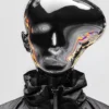 A silver chrome mirror figure with an abstractly shaped head reflecting distorted surroundings