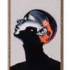 Mockup of grainy silver chrome portrait of a woman in a black turtleneck, exuding a futuristic aesthetic, inside an elegant wood frame